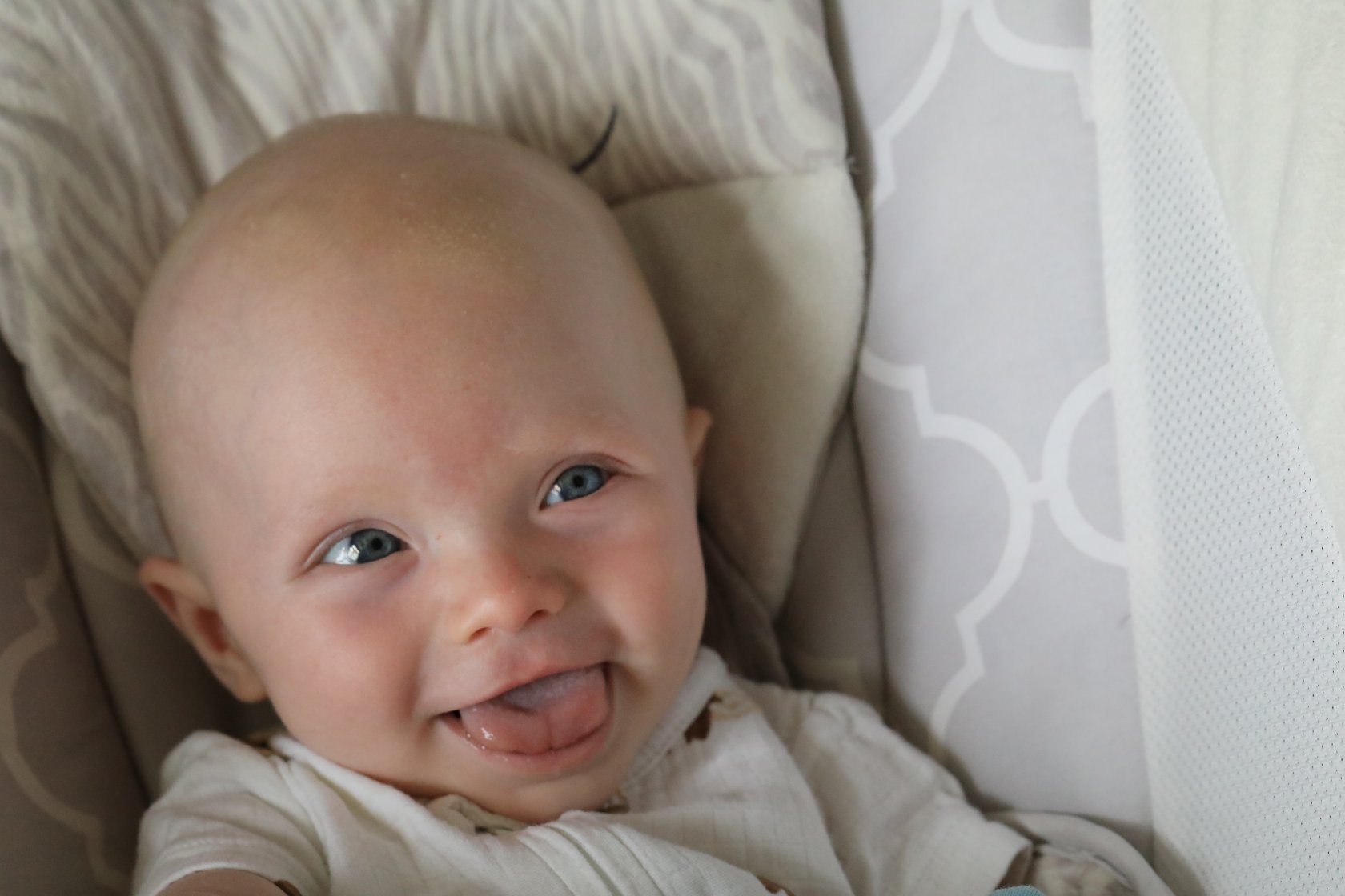 smiling grandson at four months of age